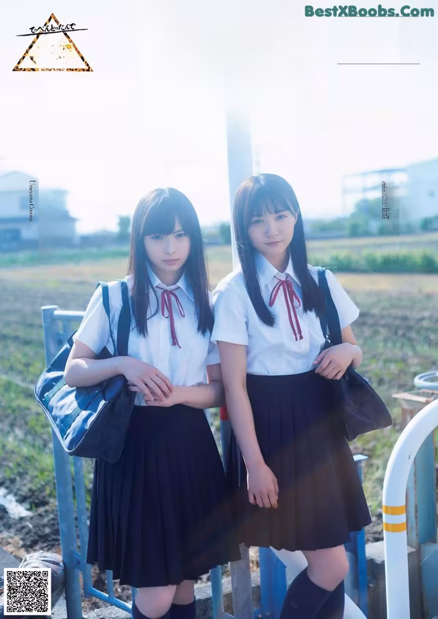 A couple of young women standing next to each other.